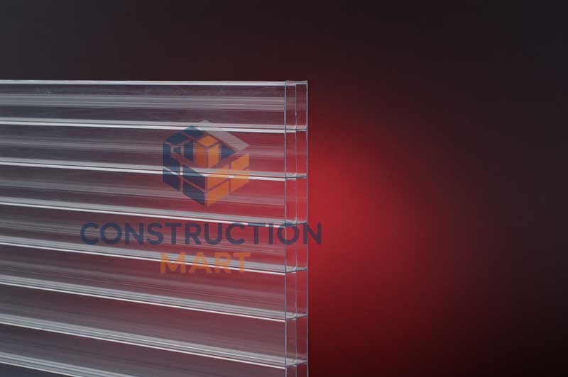 Clear 10mm triple wall polycarbonate sheet displayed on red background for product detail photography