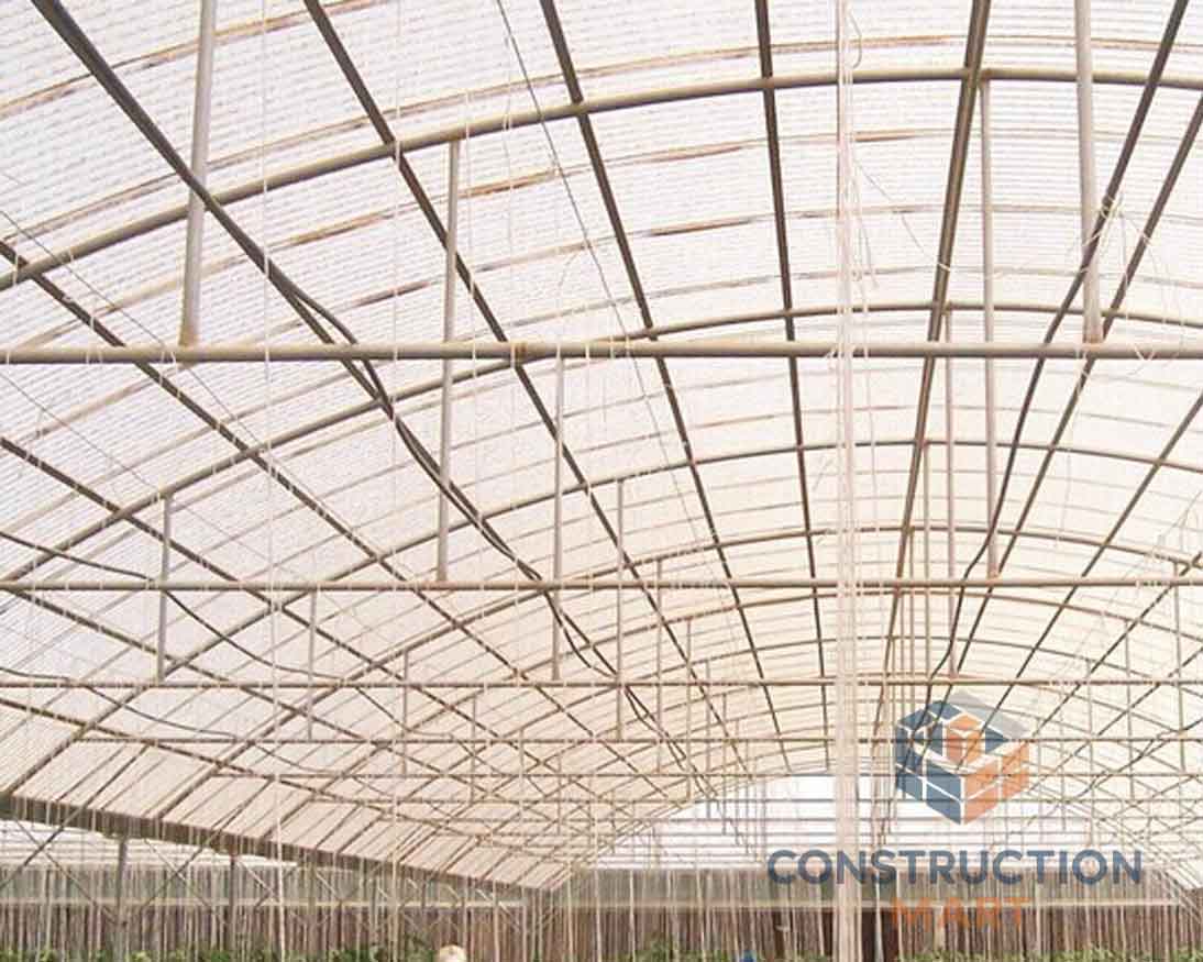 Interior view of an agricultural greenhouse using Constructionmart 840 polycarbonate corrugated sheets for optimal light transmission and UV protection.
