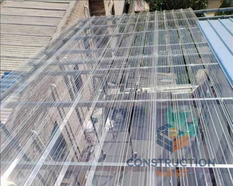 Top-down view of a walkway canopy made with Constructionmart 840 polycarbonate corrugated sheets, featuring a sleek and transparent design.