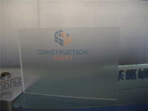  Frosted polycarbonate sheet photographed from one side to the other, highlighting its elegant light diffusion for architectural glazing applications.