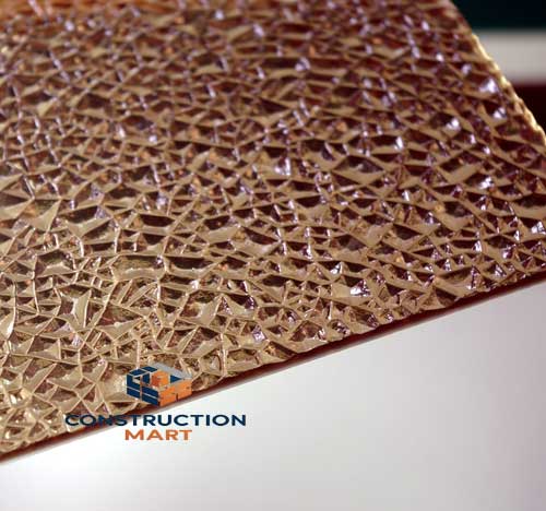 Light bronze diamond-textured polycarbonate sheet sample by Constructionmart, offering elegant light transmission and a premium aesthetic ideal for upscale retail displays.