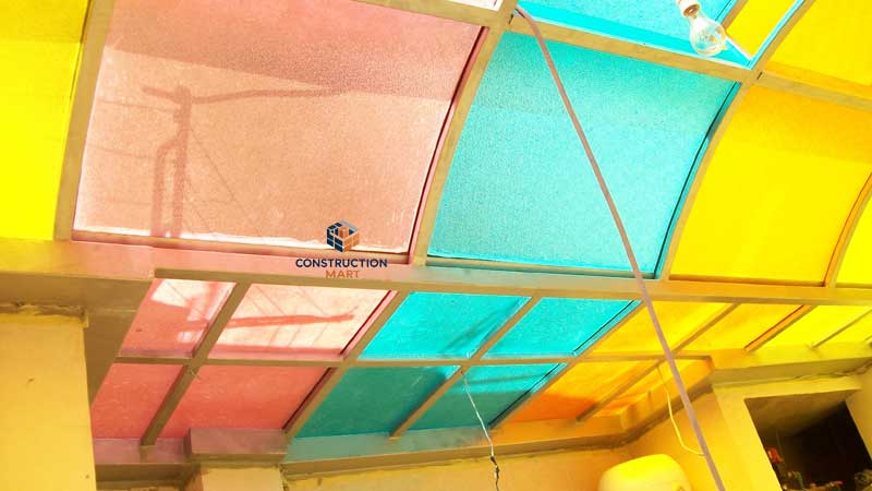 Colorful diamond-patterned polycarbonate sheets from Constructionmart used on luxury hotel resort roofs, featuring both curved and flat panels for a vibrant and stylish design.