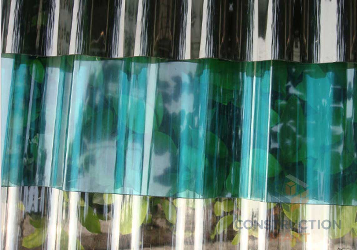 Sample stack of multi-colored round corrugated polycarbonate sheets from Constructionmart, ideal for sports and recreation facility roofing.