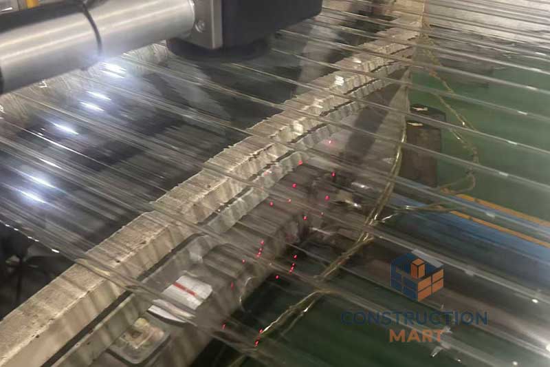 Constructionmart polycarbonate round corrugated sheet being produced, showing the manufacturing process and wave profile.