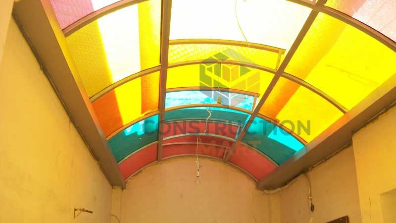 Colorful raindrop-textured polycarbonate roofing sheets by Constructionmart used in Middle Eastern architecture, combining light transmission, decoration, and privacy protection.
