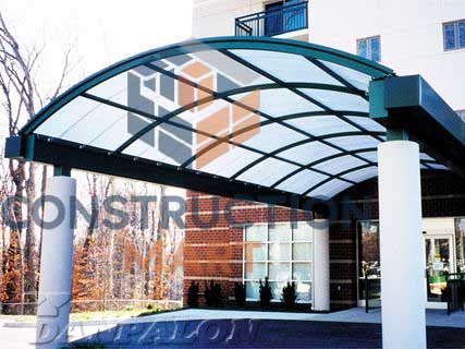 Stylish polycarbonate entrance canopy installed at a building entrance providing shelter and aesthetic appeal