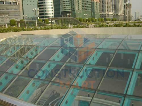 Clear polycarbonate canopy installed on commercial center roof, enhancing daylight and bright interior spaces