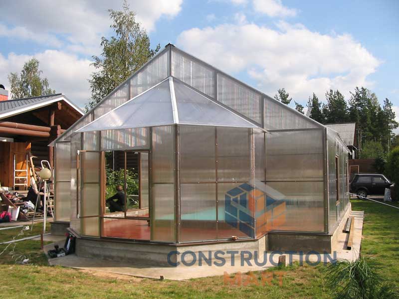 Outdoor greenhouse with pointed roof using triple wall polycarbonate sheets for sunlight control and insulation